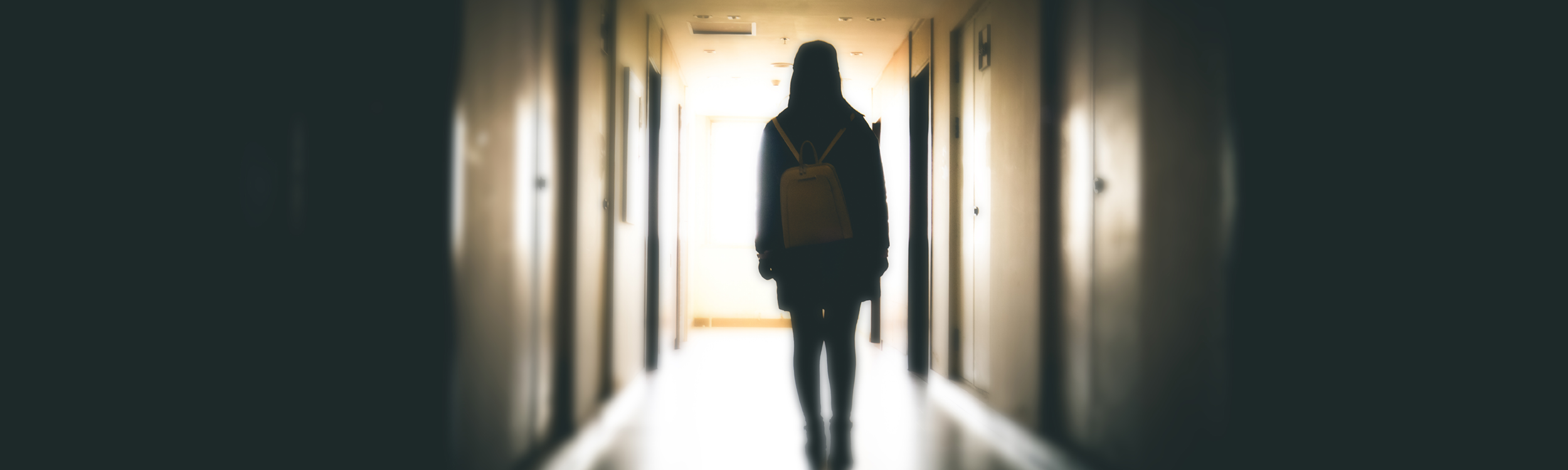 Student walking down hallway
